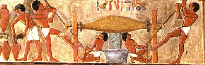 Painting from tomb of Puyemre, Thebes, showing workers twisting a torsion bag and pouring the resulting liquid into amphorae