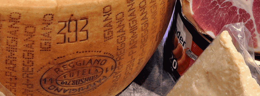 Markings on a block of certified Parmigiano-Reggiano cheese